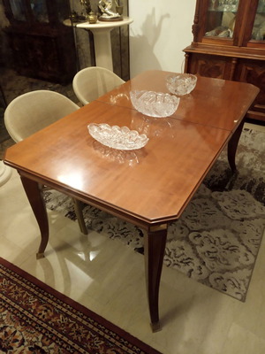 Wooden rectangular dining table used with extension leaf for 6-8 people