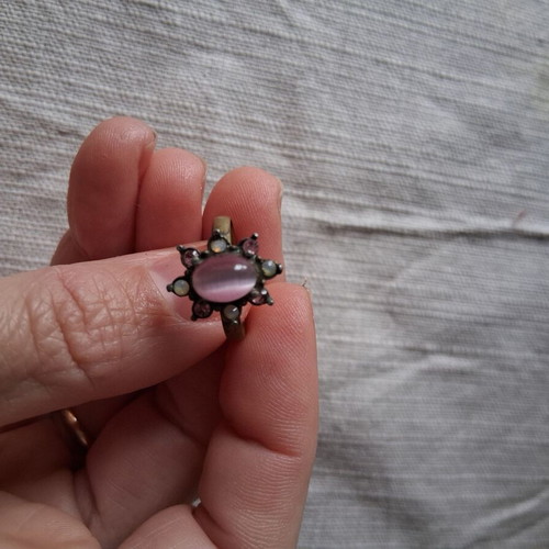Ring used matte gold color with pink stone and rhinestones