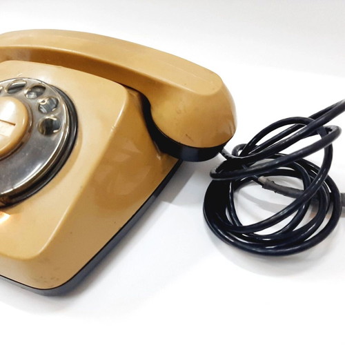 Vintage rotary phone used, beige, 1970s