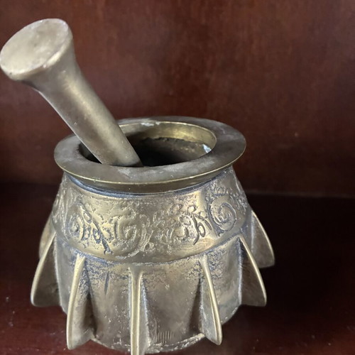 Bronze mortar and pestle used, antique with ribs and engraved design