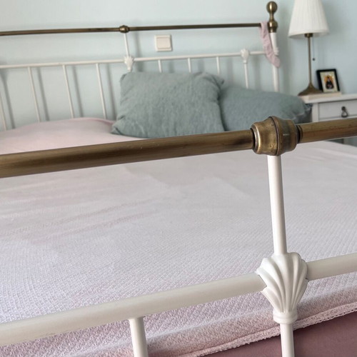 Double wrought iron bed with slats and used mattress