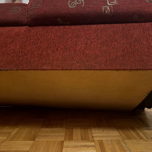 Two-seater sofa used red in good condition