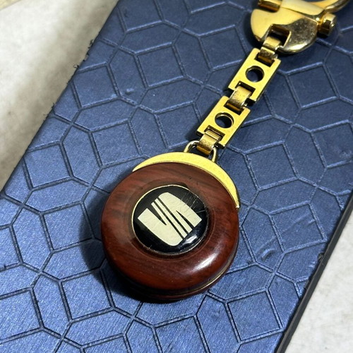 Vintage SEAT keychain used, bakelite with metal details