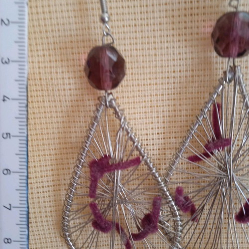Handmade earrings used with wire and amethyst-colored bead