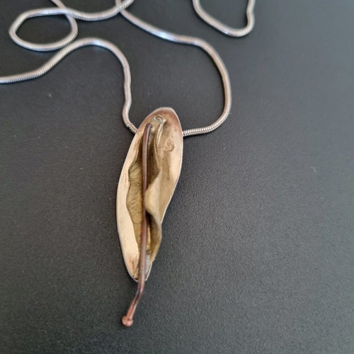 Silver handmade jewelry used with mixed materials leaf design