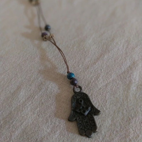 Long boho hamsa hand necklace like new, brown and blue