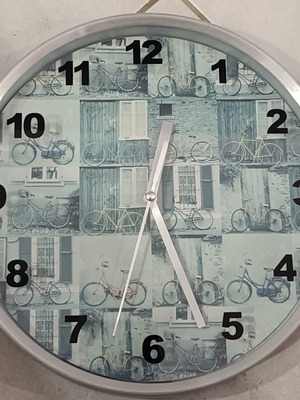 Stainless metal wall clock with bicycle design