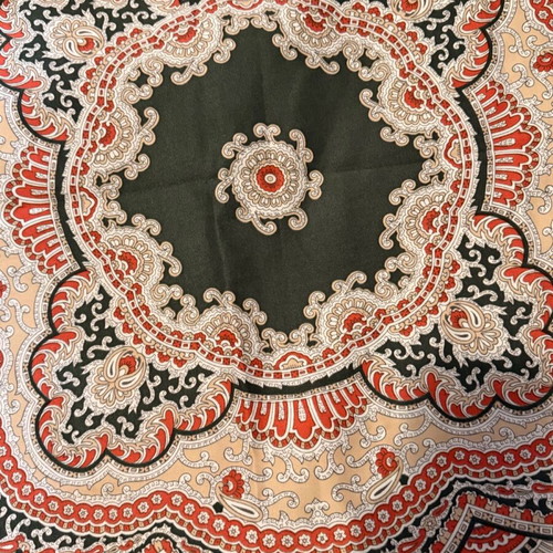 Large square scarf used in green and red