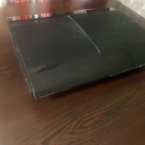 PlayStation 3 Super Slim 12 GB console like new with 4 games and controller