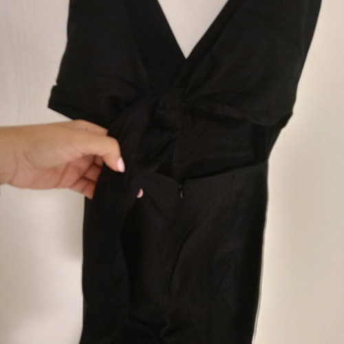 Black one-piece jumpsuit like new, deep neckline and back tie, size S