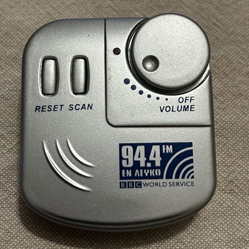 Pocket Radio with Headphones like new, silver color