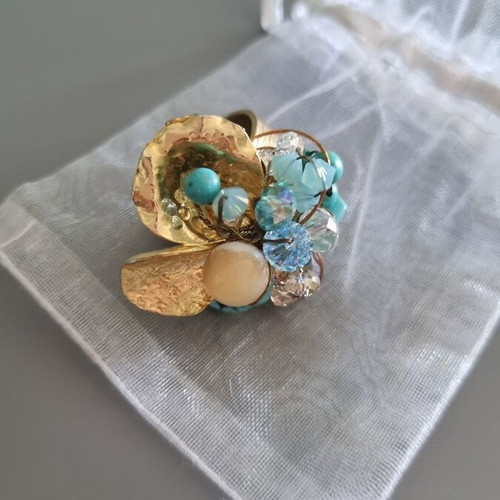 Handmade ring new with adjustable size, blue and gold colors