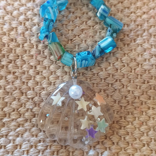 Handmade turquoise necklace with beads and transparent shell