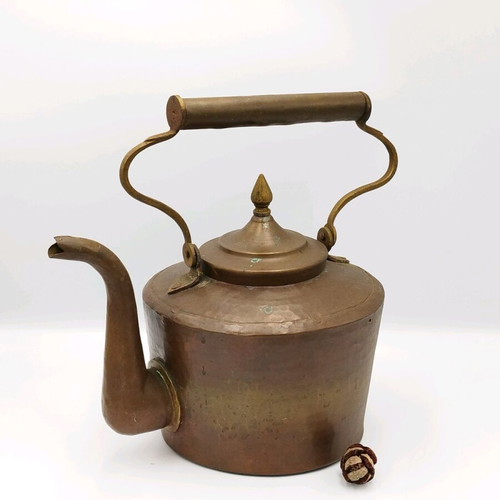 Vintage copper hand-forged teapot used with brass elements
