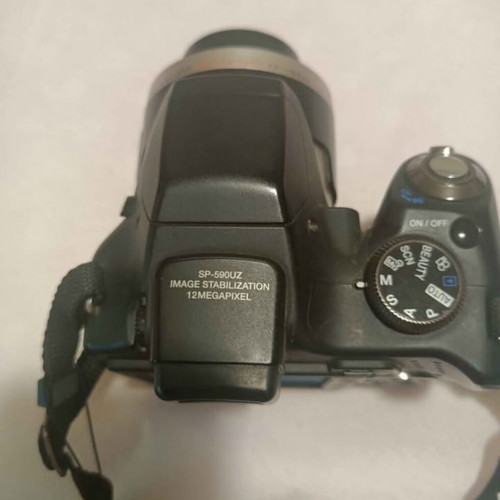 Olympus SP590UZ digital camera used, 26x zoom, retro style