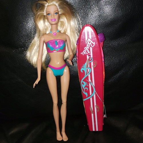 Barbie Merliah doll used with surfboard and mermaid tail