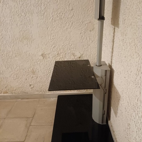 Glass TV stand with wheels like new, black and gray