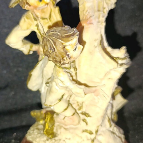 Vintage decorative figurine with children, used