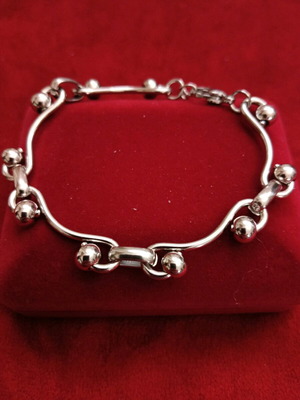 Stainless steel bracelet new, silver with intricate fastening