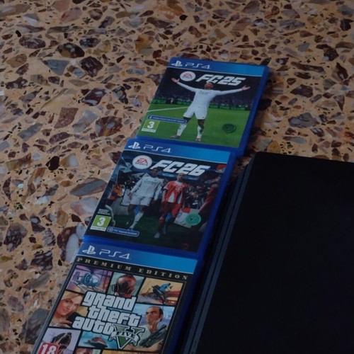 PS4 Pro console with 3 games and 2 controllers