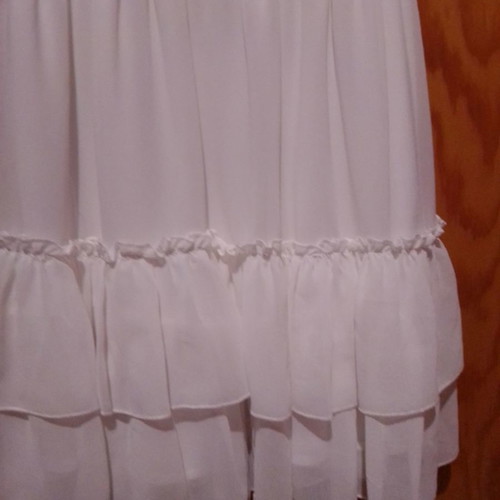 Two white dresses used, sizes 12-14 for girls