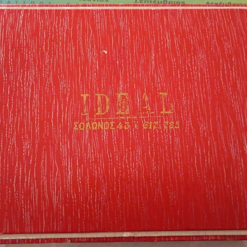Ideal cardboard chocolate box used with torn corners on lid