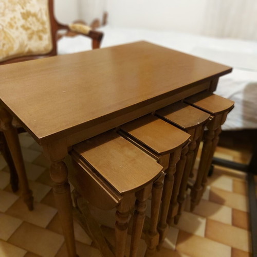 Rectangular table with 4 used round nesting tables