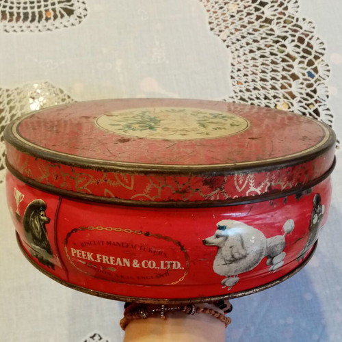 Vintage tin box used with floral and dog motifs