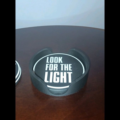 Last of Us coasters like new, set of 4 with base