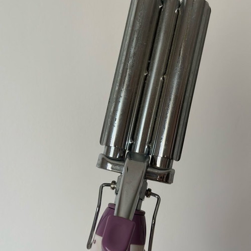 Triple hair curler used for wavy hair