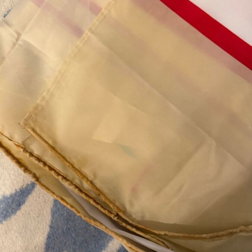 Fabric shower curtain with stripes used, metal grommets
