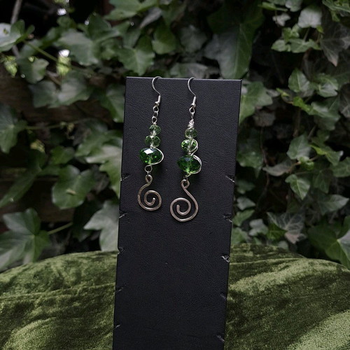Earrings with green crystals and spiral charms new, silver