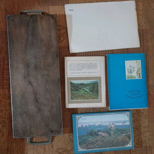 Set of old serving tray with Belgian postcards and Russian museum guides used