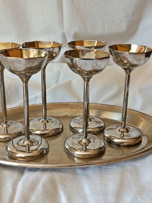 Vintage liqueur glasses used, brass with silver plating and gold interior
