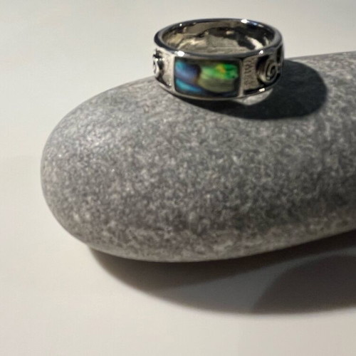 Steel ring with inlaid abalone shell details
