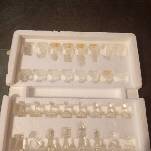 Glass chessboard used, missing one rook