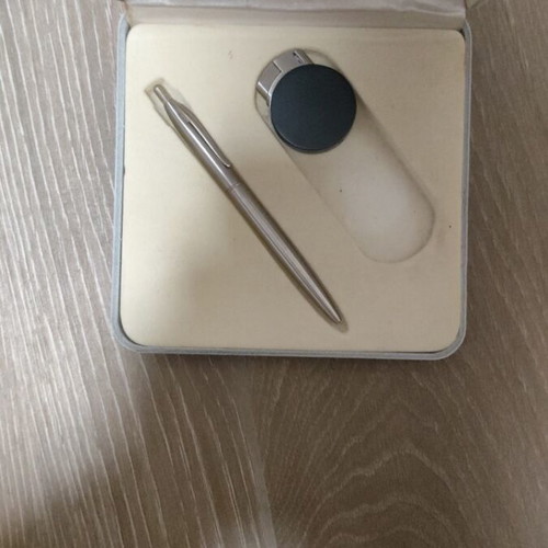 Gift set with lighters, pens, keychain, and calculator