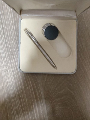 Gift set with lighters, pens, keychain, and calculator