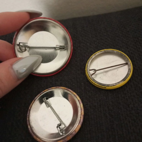 Pins two attrativo and one #we are international in good condition