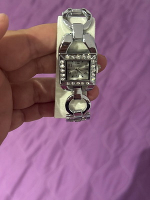 Watch, ring, and earrings set like new, gray
