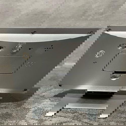 Digital table clock used with alarm and thermometer