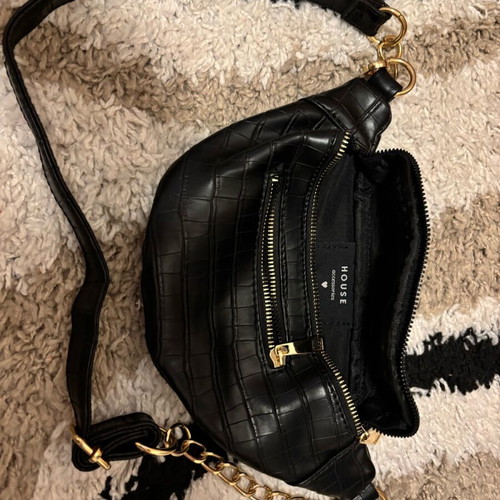 Black banana-style waist bag like new with gold details