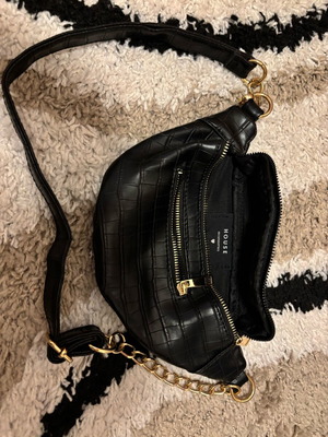 Black banana-style waist bag like new with gold details