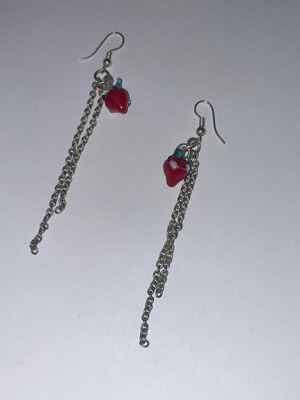 Dangling faux earrings used, red and silver