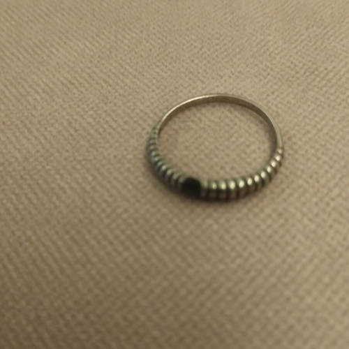 Silver ring with embossed ribbed design used
