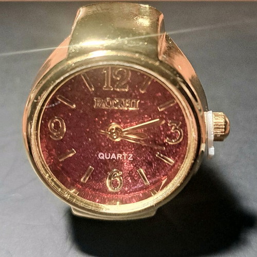 Quartz ring watch like new with purple dial and gold bracelet