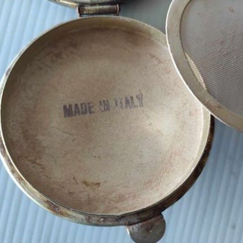 Powder compact used Made Italy with metal case and soft cover