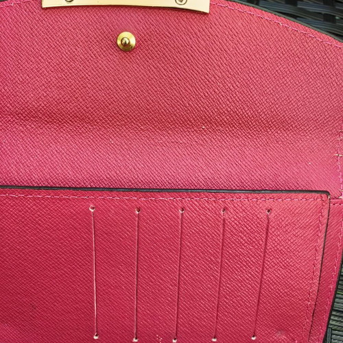 Louis Vuitton wallet used, authentic with visible marks inside