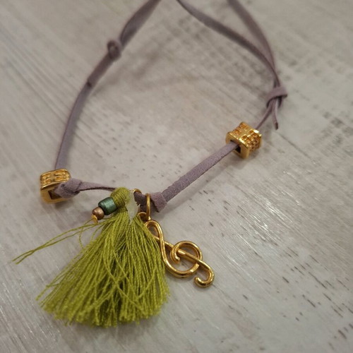 Bracelet with treble clef music note like new, multicolor