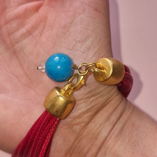 Bracelet like new red with blue bead on clasp